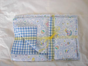 Baby receiving blanket with burp pads