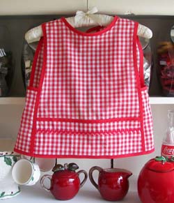 Small child apron in red gingham